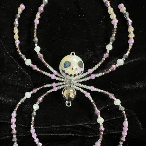 Halloween themed beaded spider with a skeleton face body