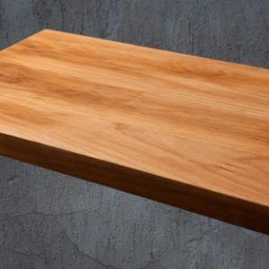 Wooden cutting board on a rustic surface with additional views and dimensions displayed.